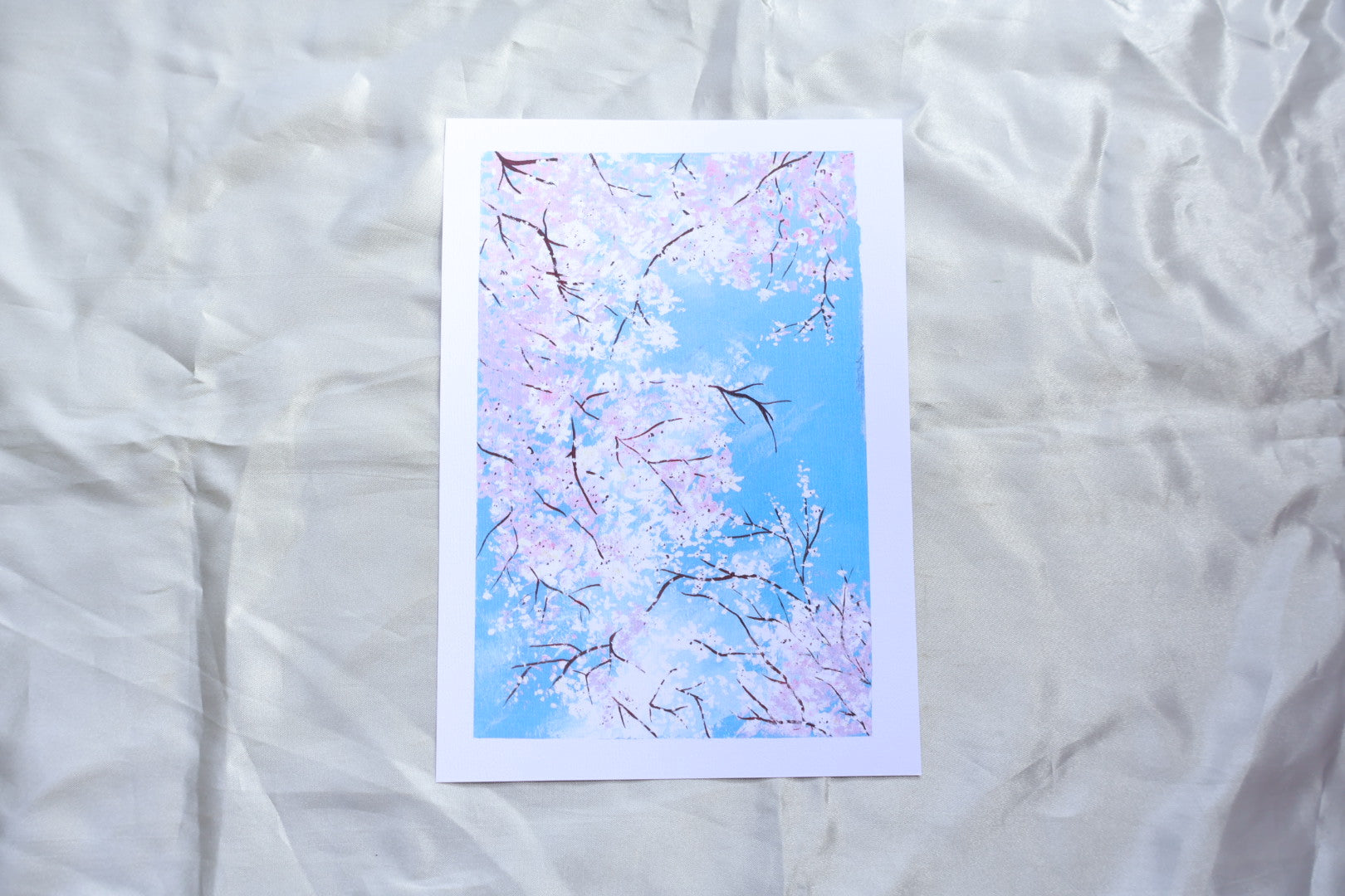 Art print showcasing Sakura Flowers blooming captured in Japan originally hand-painted and illustrated by Kit at a top view angle with brown branches

